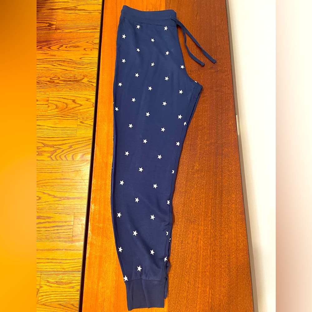 Navy sweatpants with white stars; size M